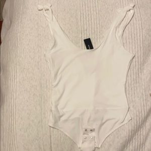 Pretty Pleased White Tie-Strapped Bodysuit Lulus